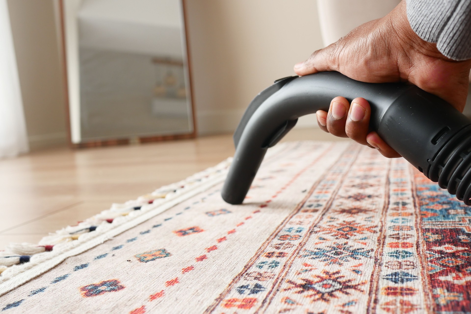 Effectively Cleaning a Beautiful Area Rug Utilizing a Vacuum Cleaner for Optimal Results