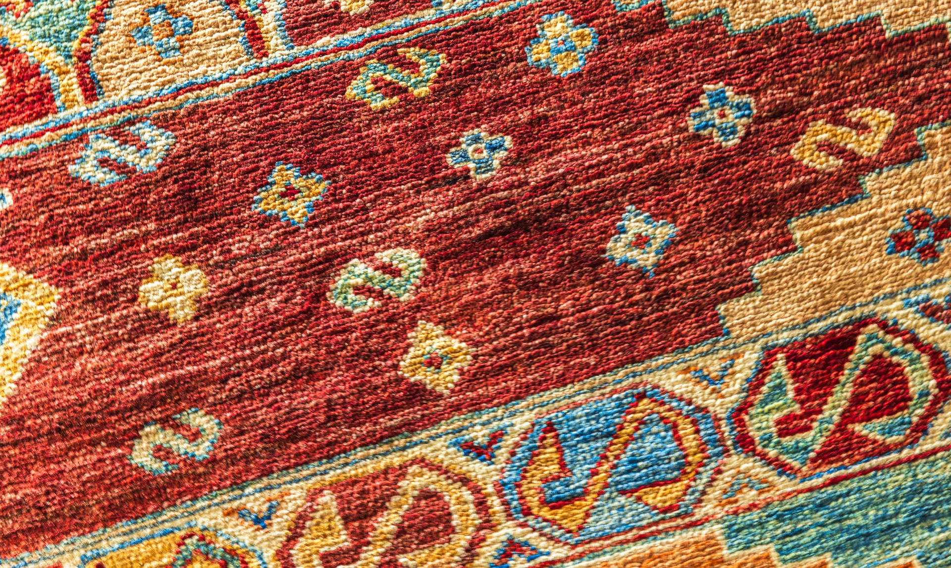 Colorful oriental silk carpet pattern, close up