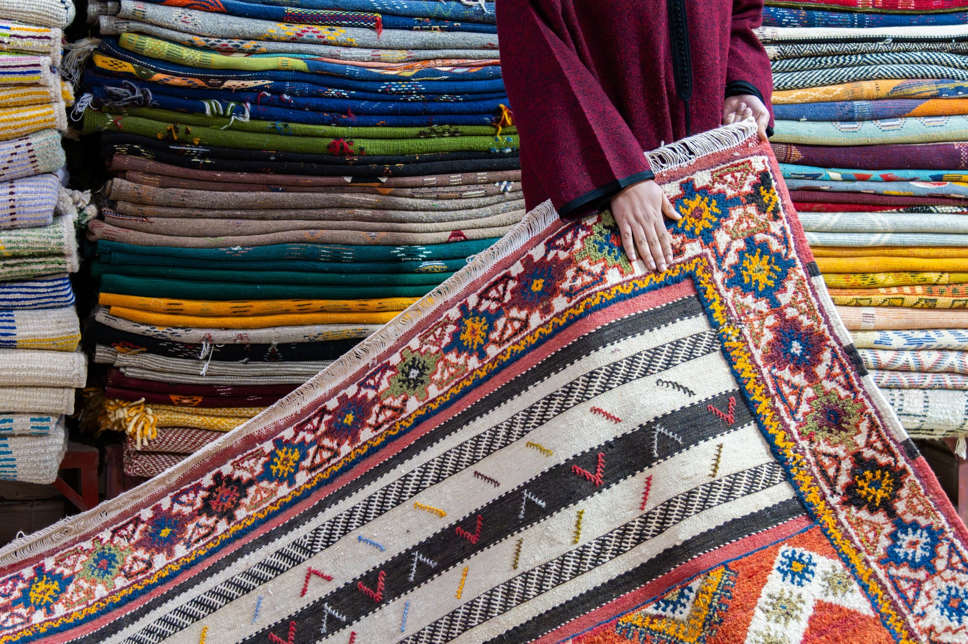 Colorful Moroccan Rugs Displayed in a Vibrant Artisan Market